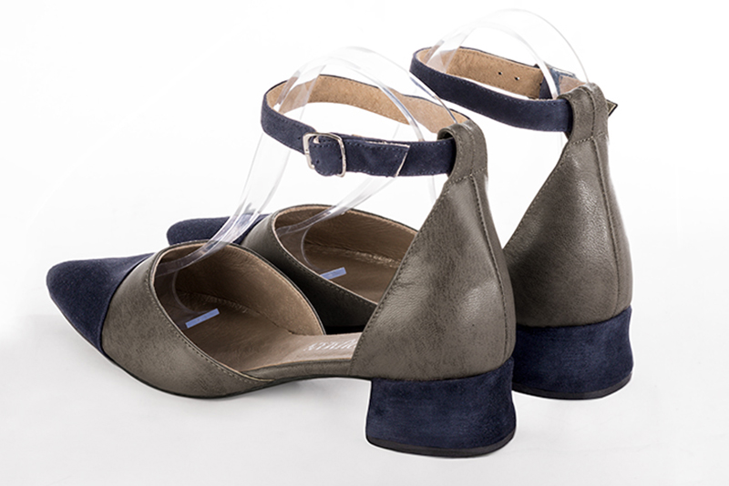 Navy blue and taupe brown women's open side shoes, with a strap around the ankle. Tapered toe. Low flare heels. Rear view - Florence KOOIJMAN